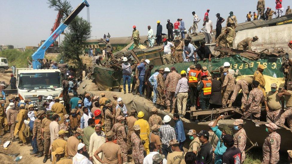 Rescuers search the wreckage for survivors