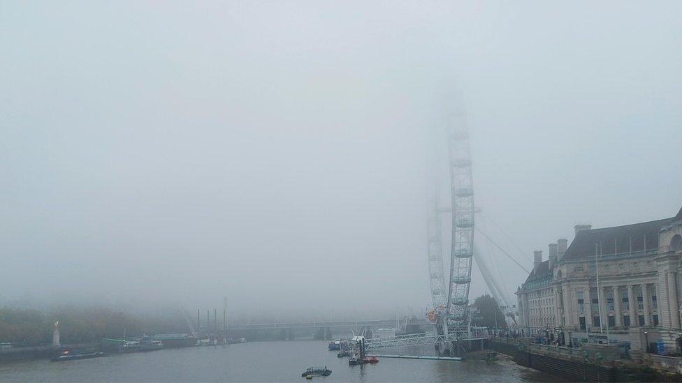 London eye in fog