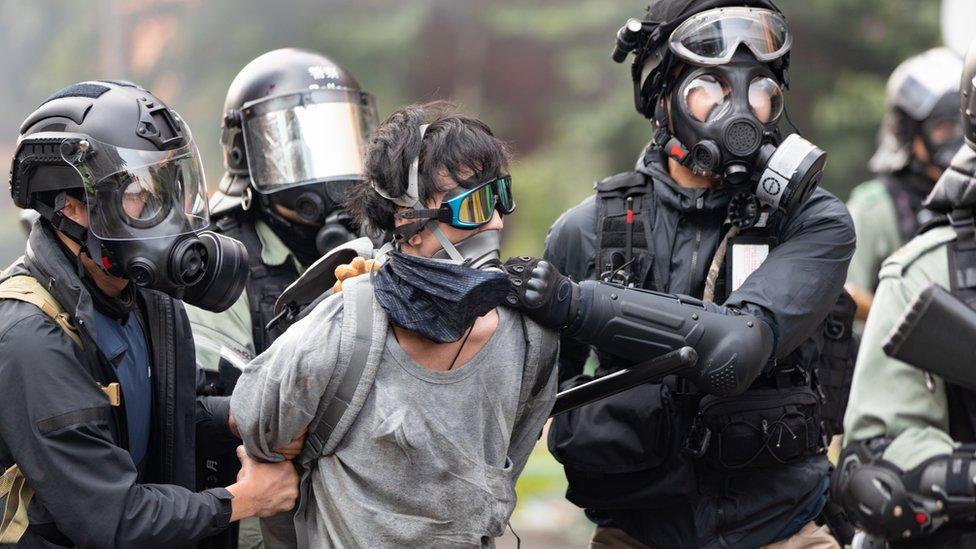 Hong Kong protester being arrested by police.