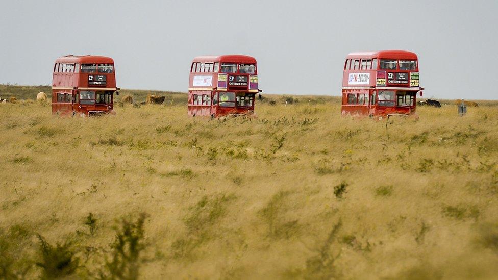 Routemaster buses on their way to the deserted village of Imber on Salisbury Plain, Wiltshire