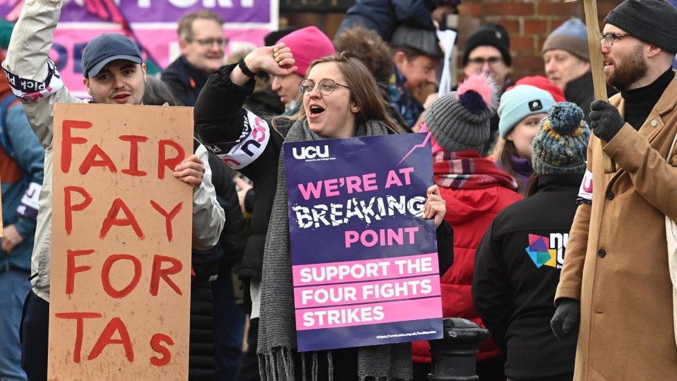 Staff protest outside Queen's University in Belfast