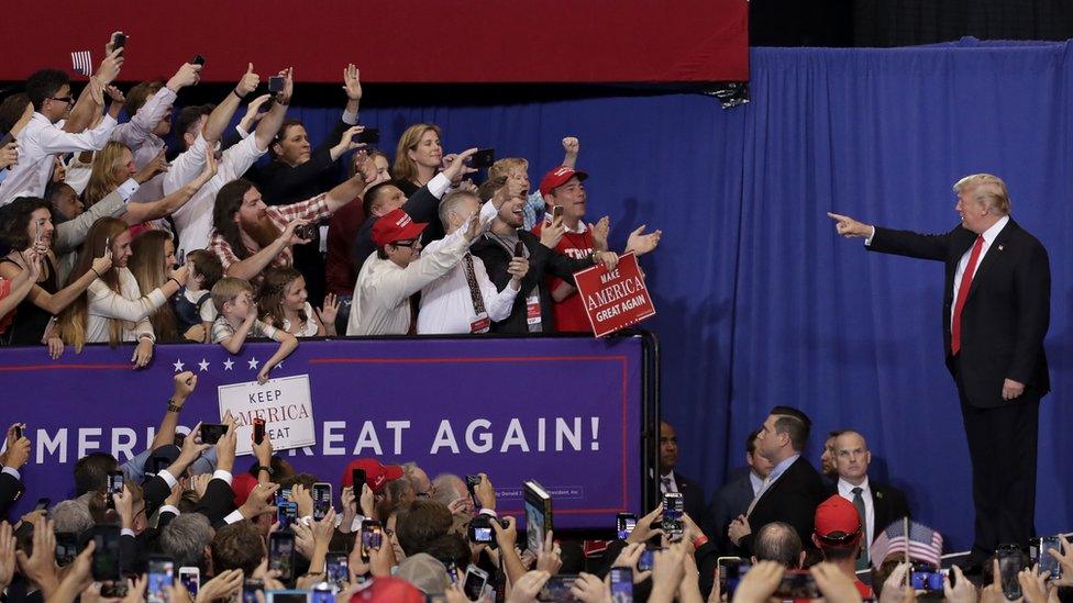 Donald Trump points to supporters in Nashville.