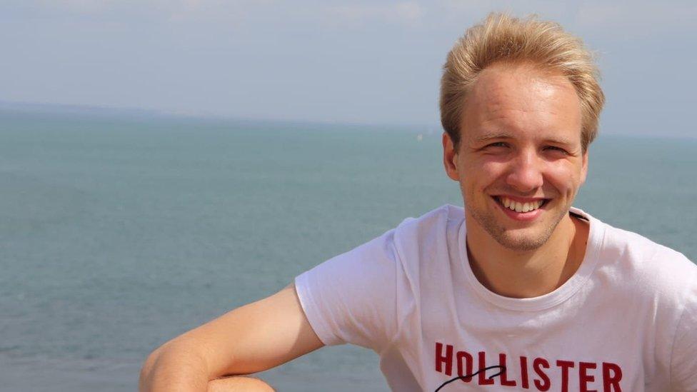 Picture of Will smiling in front of the sea