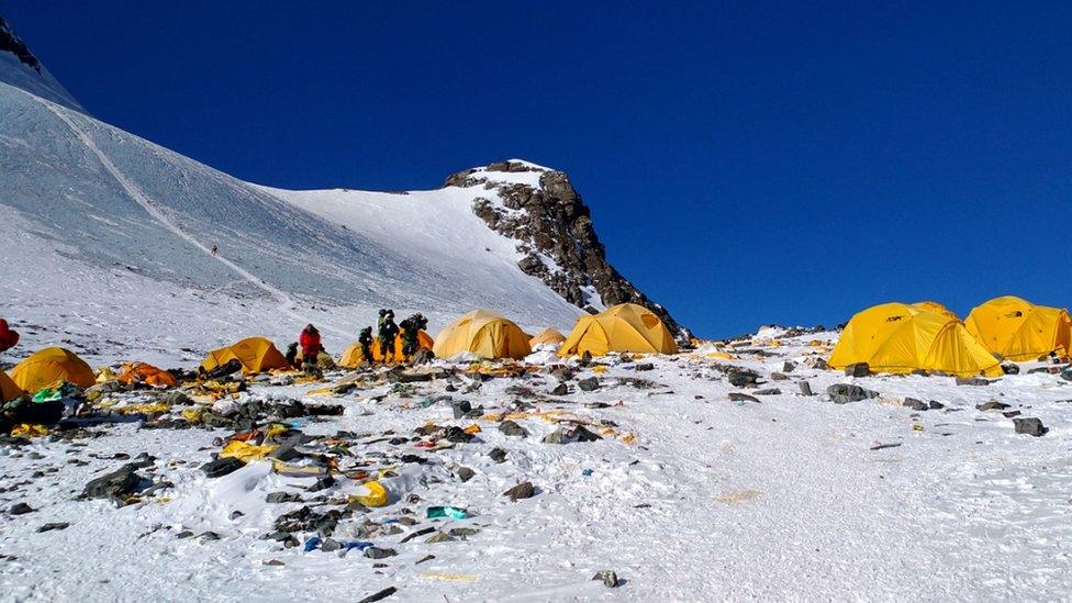 This picture taken on May 21, 2018 shows discarded climbing equipment and rubbish scattered around Camp 4 of Mount Everest.