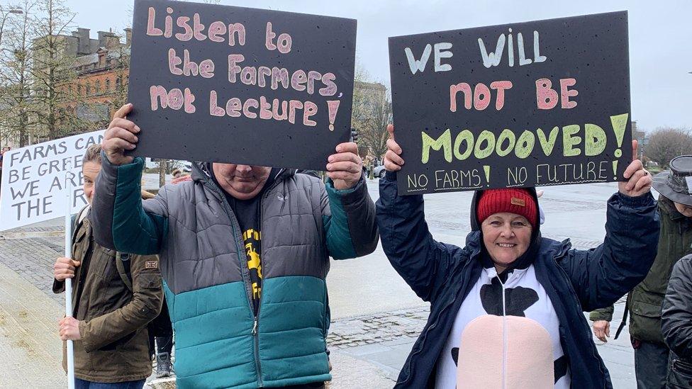 Protestors holding placards