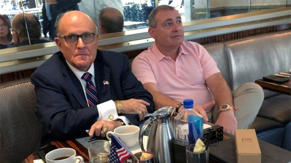 President Trump"s personal lawyer Rudy Giuliani has coffee with Ukrainian-American businessman Lev Parnas at the Trump International Hotel in Washington