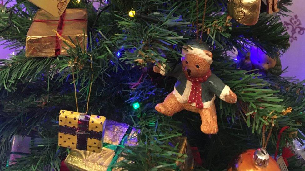 Teddy bear ornament on Christmas tree