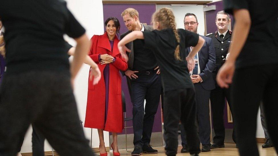 Meghan and Prince Harry watch a dance troupe