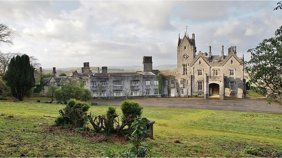 wide shot of the mansion