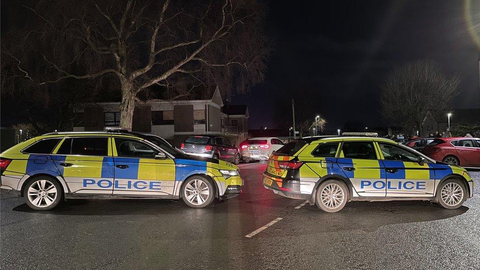 Police vehicles at the scene