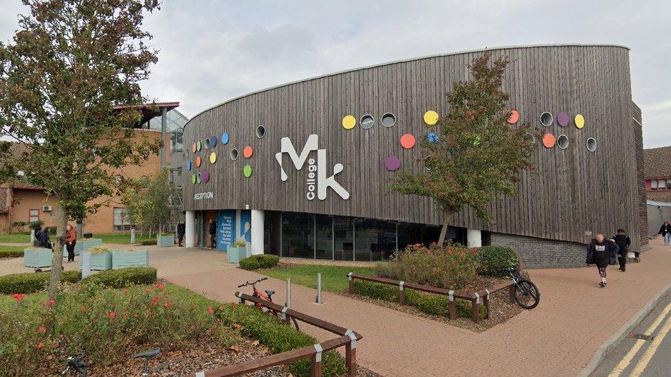 Milton Keynes College - a timber-clad building with trees in the foreground