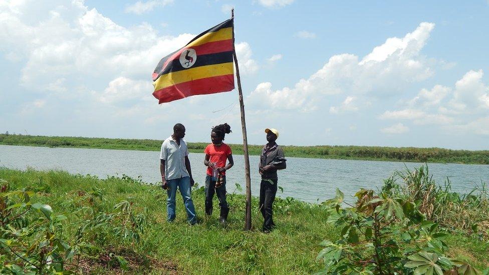 Residents by the flagpole