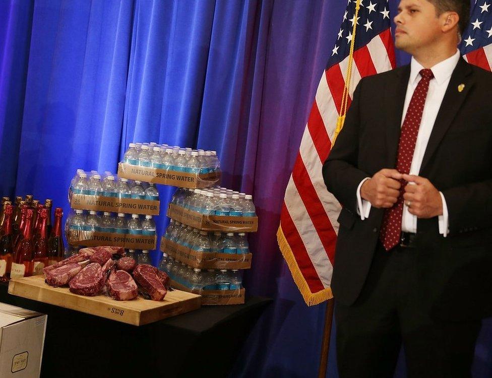 Donald Trump steak guarded by security at a press conference at the Trump National Golf Club Jupiter on March 8, 2016 in Jupiter, Florida