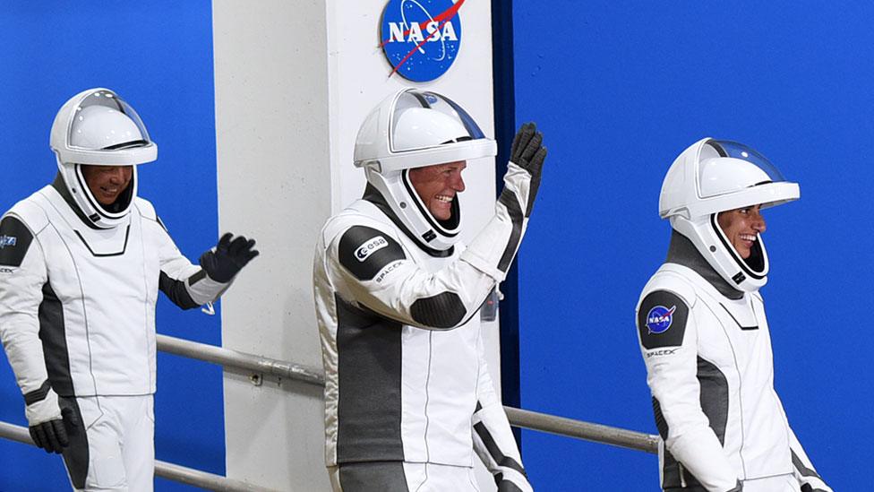 Crew-7 members wave as they walk out of the Neil A. Armstrong Operations and Checkout Building before riding to pad 39A at the Kennedy Space Center for the launch of the SpaceX Falcon 9 Crew-7 mission on 26 August 2023 in Cape Canaveral, Florida, US