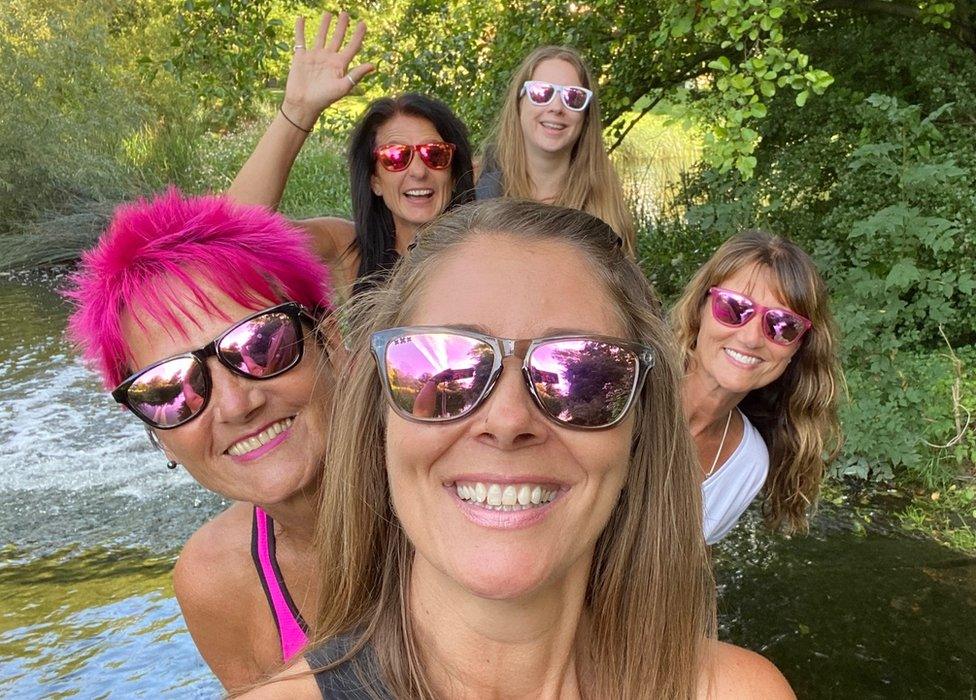 Melanie Miller with friends she has made through paddleboarding