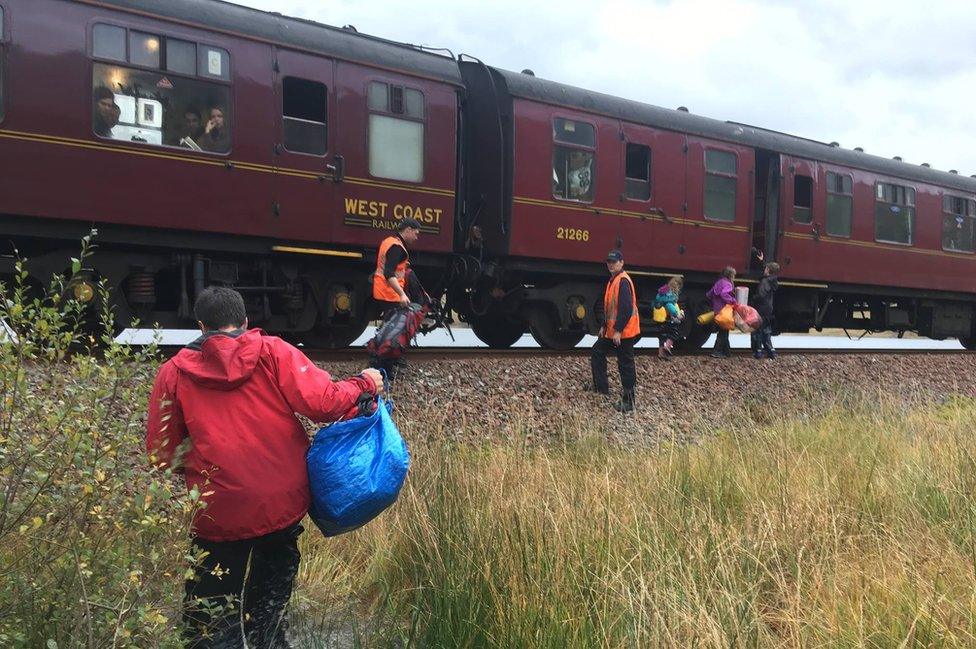 Family getting on to train