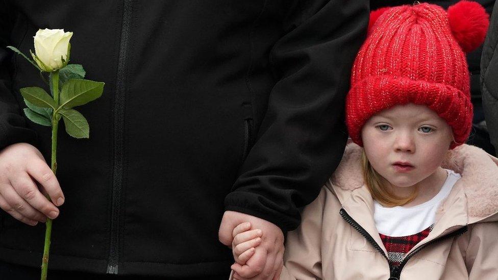 a little girl at the bloody Sunday 50th anniversary walk of remembrance