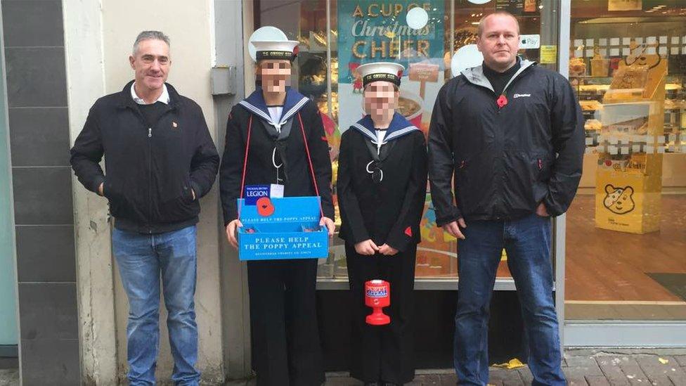 Nottingham Sea Cadets said the two children unintentionally posed for the picture with the two men