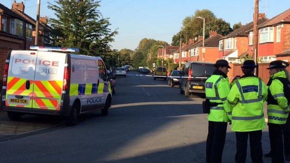 Police at the crime scene in Salford