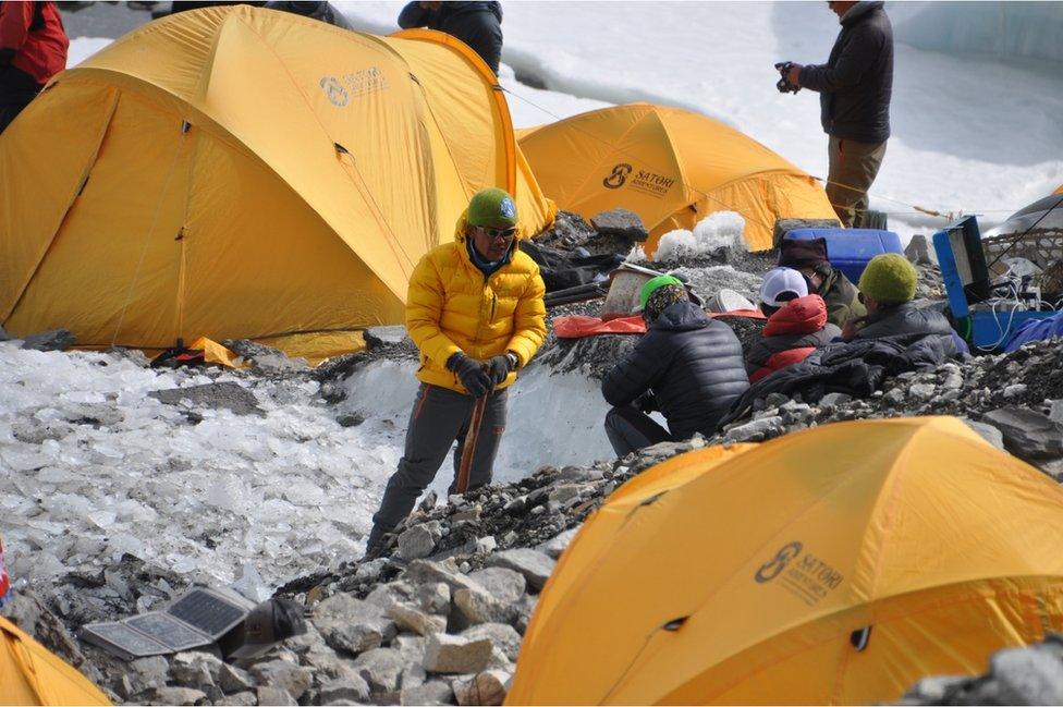 Guides and tents at base camp