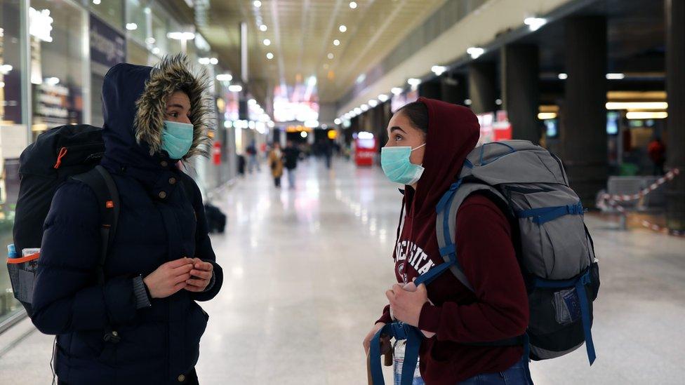 Travellers at Venice's Santa Lucia train station