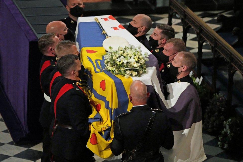 The coffin is carried into St George's Chapel during the funeral of Britain's Prince Philip, who died at the age of 99, at Windsor Castle, Britain, April 17, 2021.