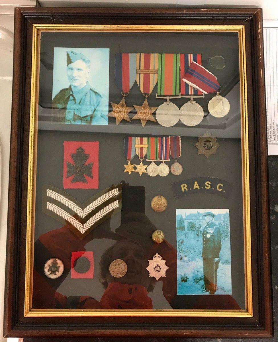 Framed war medals and photographs