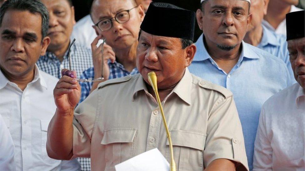 Indonesian presidential candidate Prabowo Subianto speaks to the media after polls closed in Jakarta, Indonesia April 17, 201