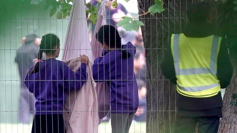 Children play inside the Manston immigration short-term holding facility located at the former Defence Fire Training and Development Centre in Thanet, Kent. Picture date: Tuesday November 1, 2022. PA Photo. Home Secretary Suella Braverman has denied ignoring legal advice to procure more accommodation amid warnings the temporary holding centre at Manston in Kent was dangerously overcrowded. Photo credit should read: Gareth Fuller/PA Wire