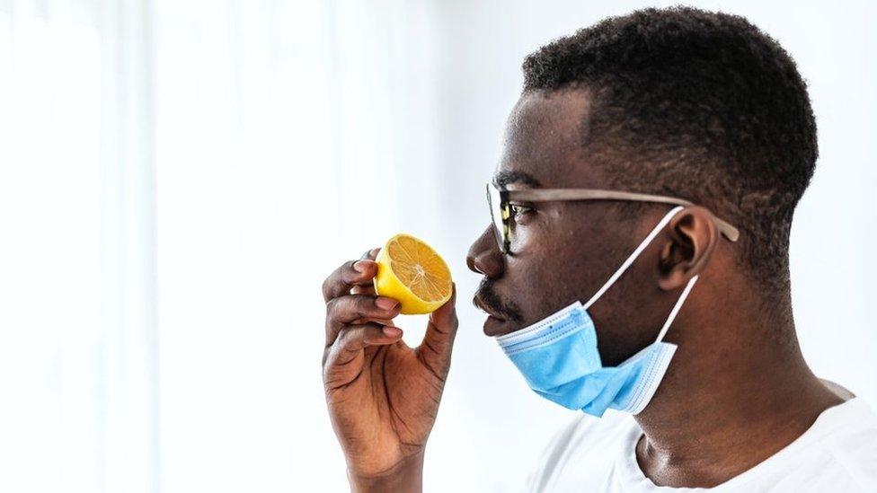 Man sniffing a lemon