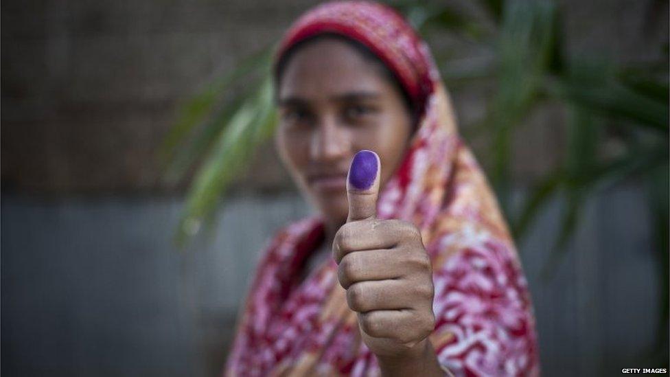 Bash Kata Indian enclave resident, Musamat Lipi, stands for a photo after choosing Bangladeshi citizenship with the Enclaves Exchange Coordination Committee