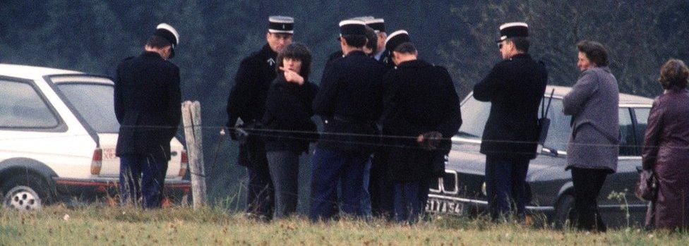 Christine Villemin (third from left) takes part in the crime scene reconstruction on October 30, 1985