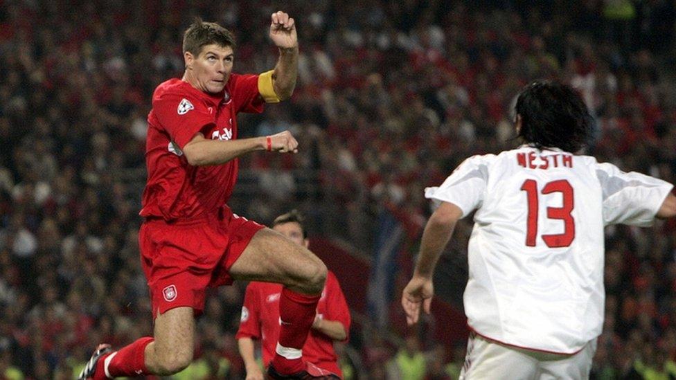 Steven Gerrard headers the ball