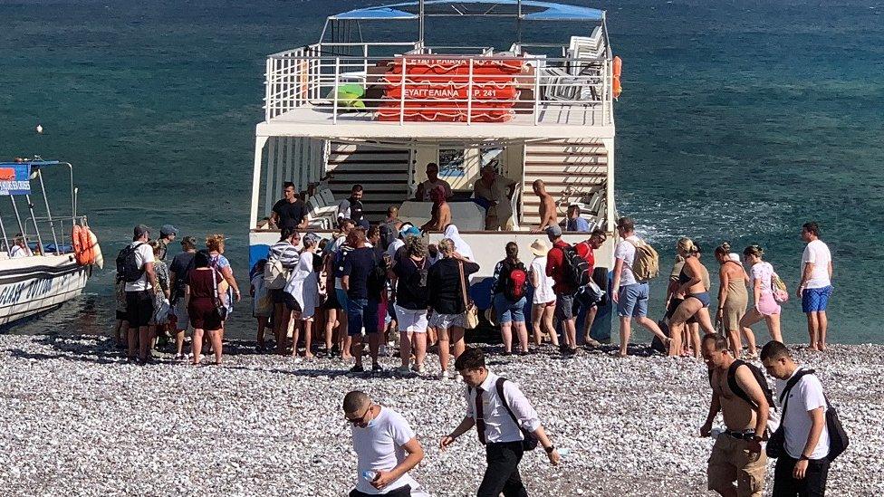 Tourists evacuating Rhodes