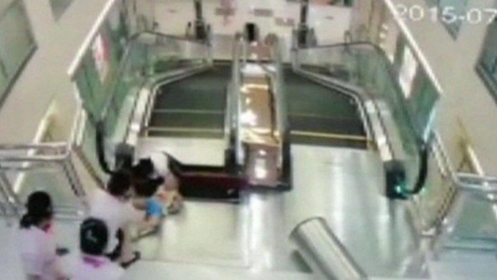 Surveillance video showing the woman and child on the escalator, provided by CCTV to Reuters, 26 July 2015