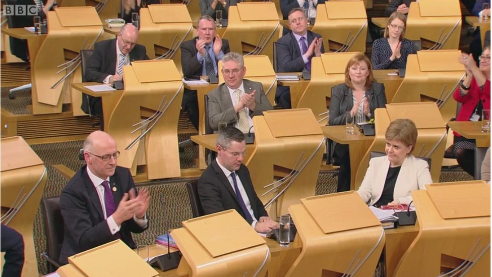 MSPs applaud as the general principles of the budget are passed