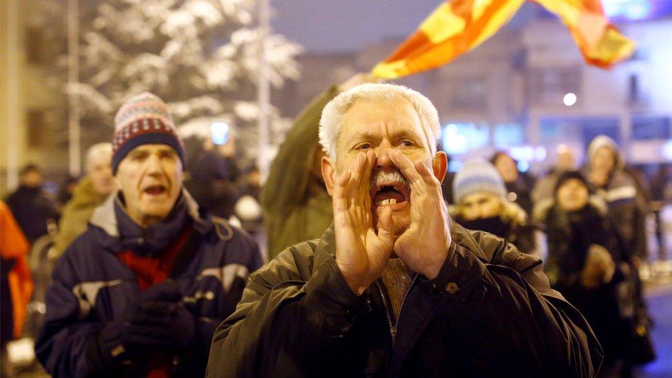 Opponents to the name change protest outside the parliament in the capital, Skopje