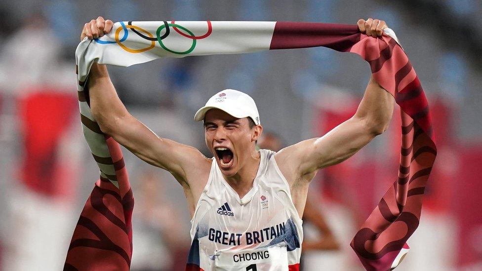 Joseph Choong of Great Britain celebrates a gold medal following victory in the the Modern Pentathlon, Men"s Individual - Laser Run