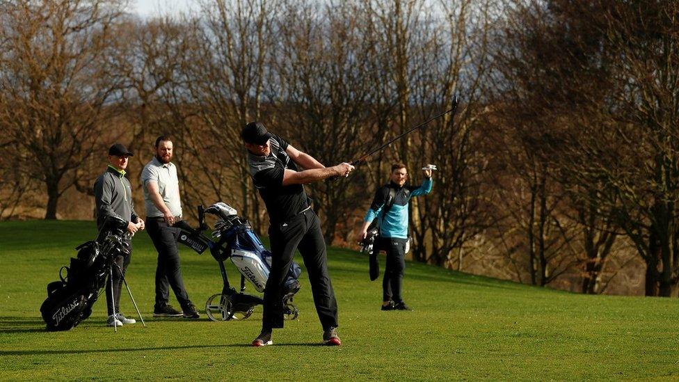 Golfers play at Hartford Golf Club