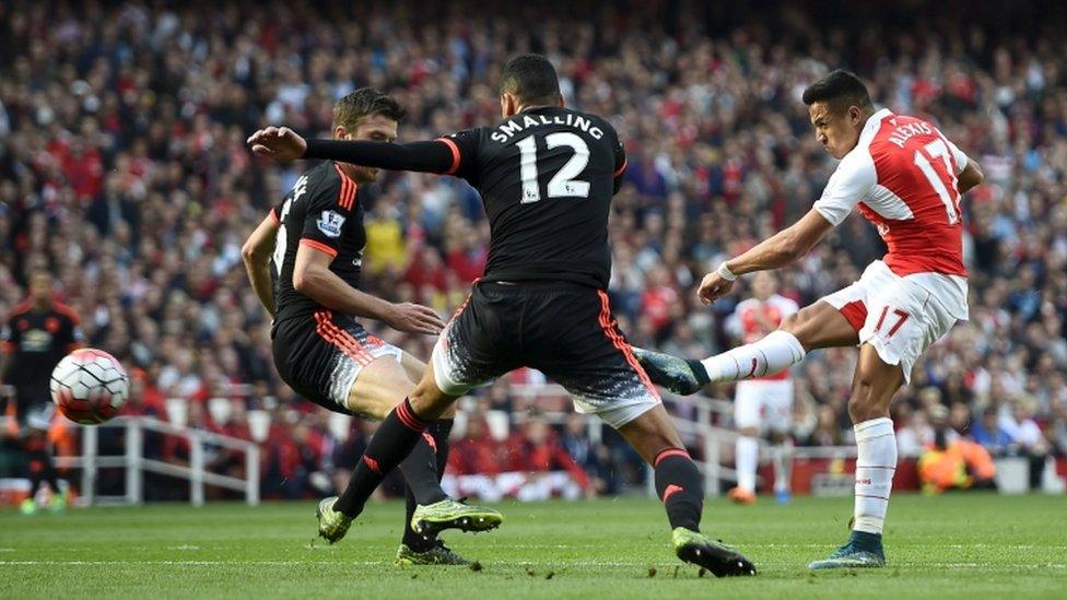 Arsenal's Alexis Sanchez scores against Manchester United in the Premier League on 4 October, 2015