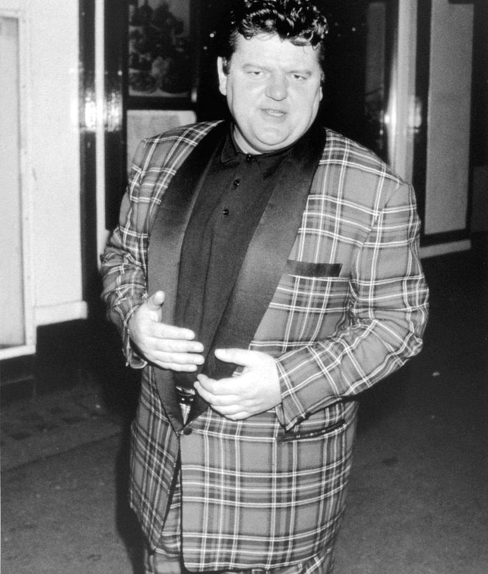 Robbie Coltrane in a tartan suit