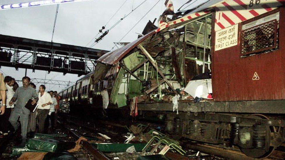 The mangled compartment of one of the blast affected local trains stands at a railway station in Mumbai, 11 July 2006. Seven explosions ripped through commuter trains during evening rush hour in India's financial capital Mumbai, killing 140 people in an attack quickly blamed on terrorists.