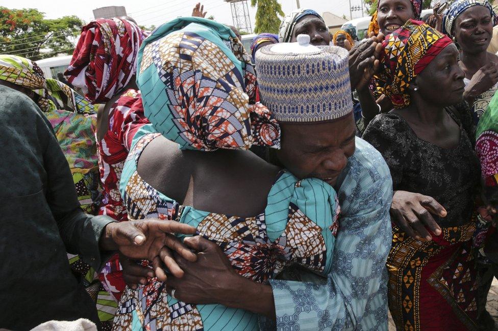 A father being reunited with one of the released Chibok girls in Abuja.