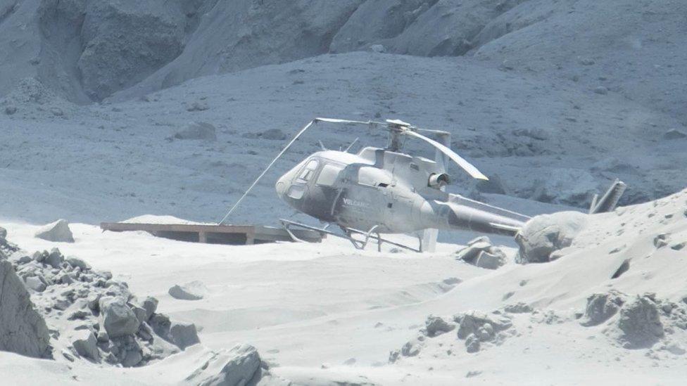 Helicopter covered in ash on White Island, 9 December