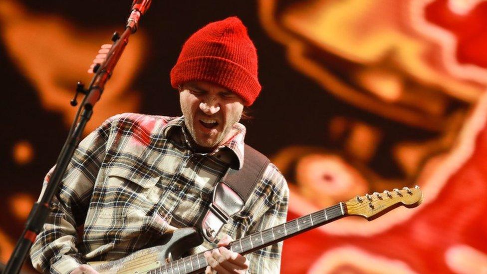 John Frusciante playing the guitar