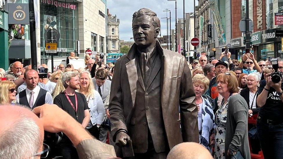 Crowds surround Brian Epstein statue