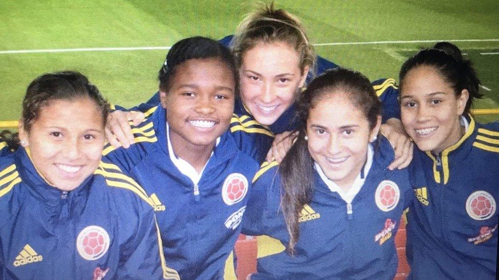 A group of women in blue football jackets