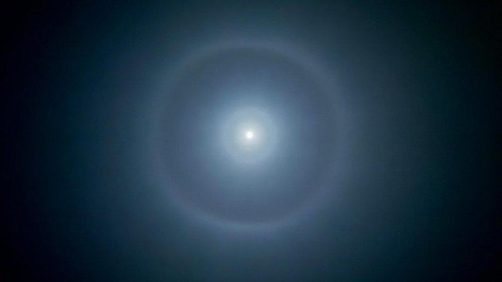 Double moon halo with a shimmery purple colour