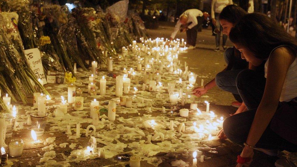 Colombians candles and flowers in tribute to the Chapecoense soccer team at Atanasio Girardot Stadium in Medellin