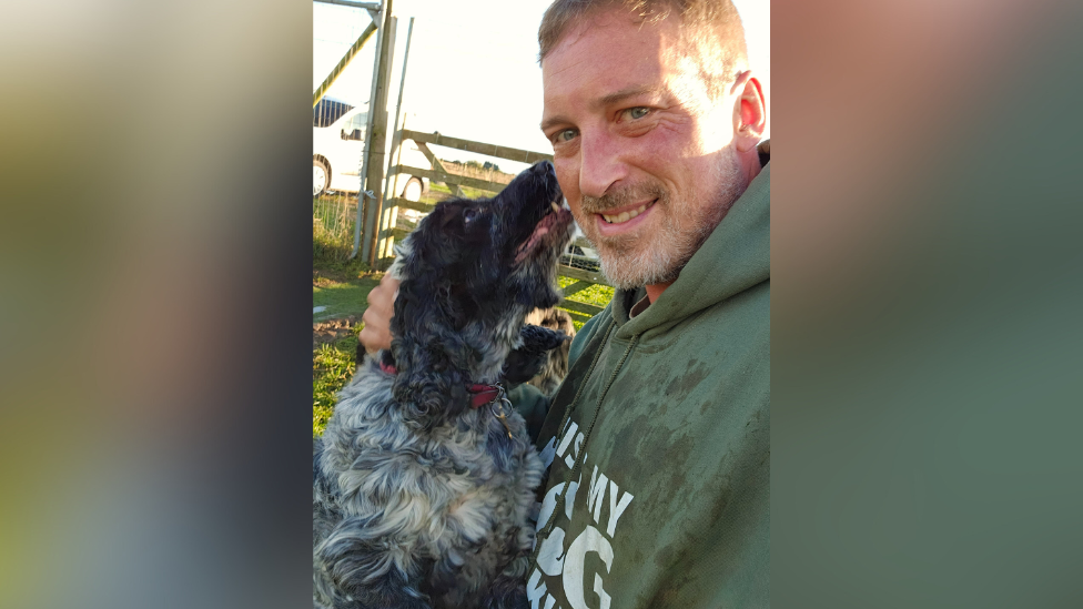 Jason Dean, owner of The Dog Play Company, with a dog